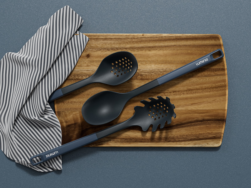 L-TOOLS person cooking in a skillet using a silicone spatula, demonstrating practical and precise cooking tools.