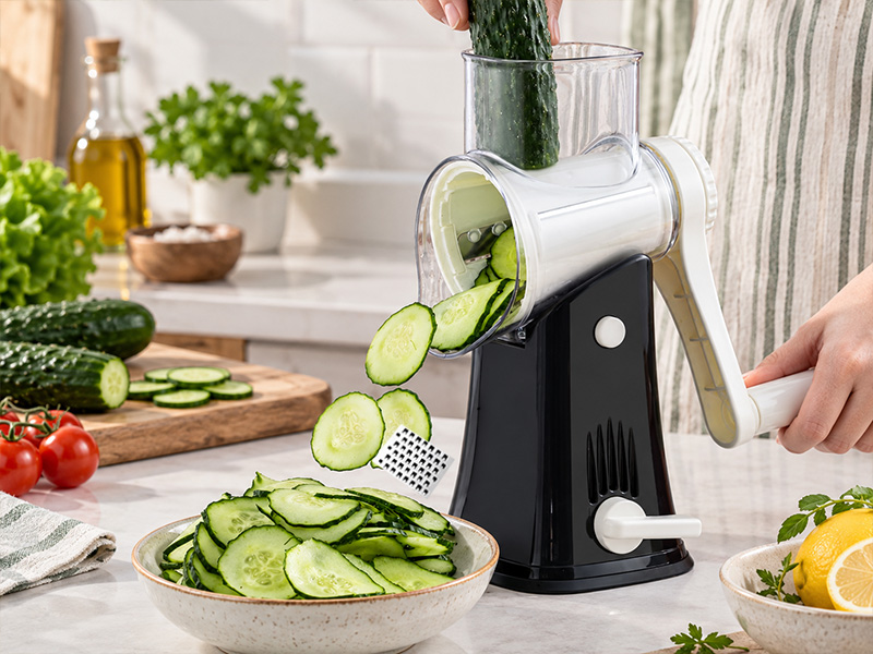 l-tools vegetable slicer and shredder for cutting cucumbers and preparing kitchen ingredients.