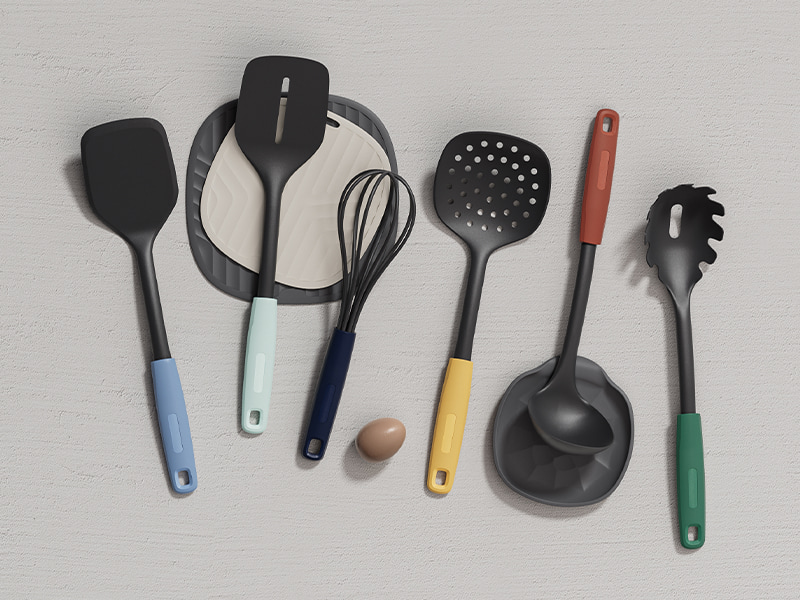 L-TOOLS kitchen setup with various cooking tools including spatulas and ladles, highlighting organized kitchen workspace.