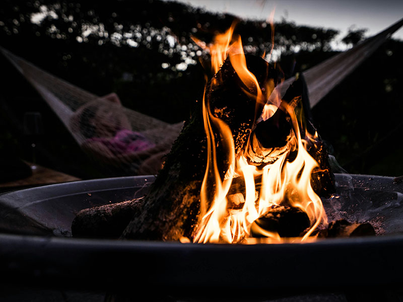 L-TOOLS outdoor fire pit with warm flames for camping and backyard gatherings.