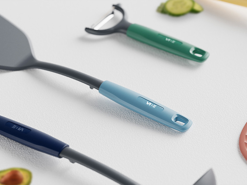 L-TOOLS close-up of handheld kitchen tools, including peelers, highlighting product design and usability.