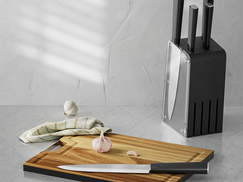 L-TOOLS chef preparing food on a wooden cutting board with garlic and knife, highlighting cooking preparation.