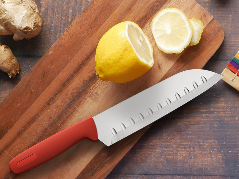 L-TOOLS chef slicing a lemon with a sharp kitchen knife on a wooden board, highlighting cutting precision.