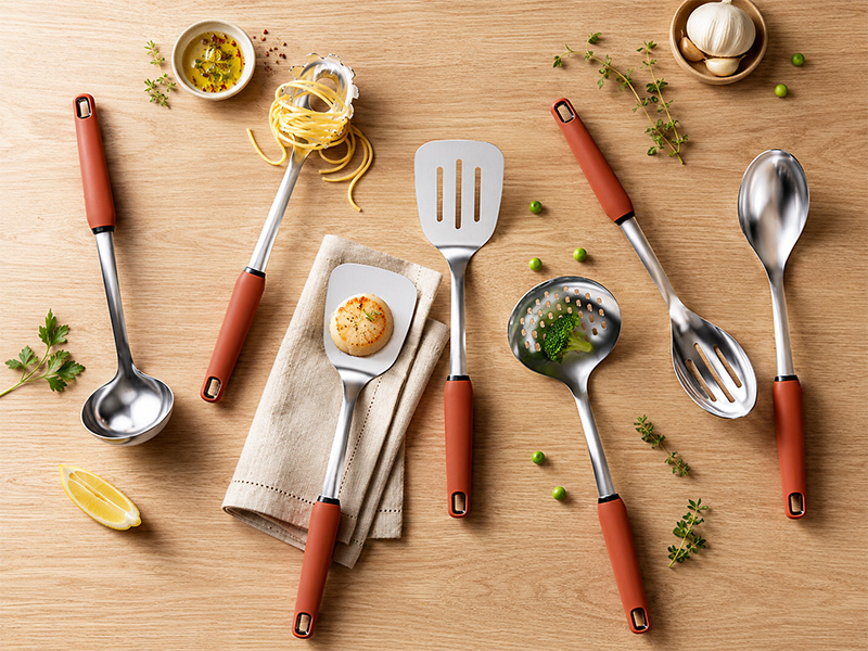 L-TOOLS stainless steel kitchen utensils including spatulas, spoons, and cooking tools for food preparation.