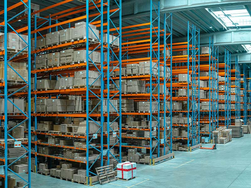 L-TOOLS warehouse racking system storing inventory, emphasizing industrial organization and storage solutions.