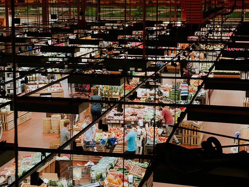 L-TOOLS aerial view of a bustling market or mall interior, emphasizing organized commercial space.