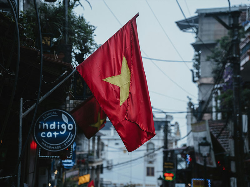 L-TOOLS Vietnamese flag displayed on a street, symbolizing national identity and culture.