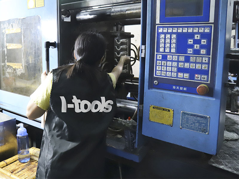 L-TOOLS technician operating CNC machinery, illustrating high-precision production workflow.