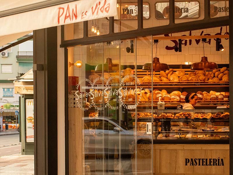 L-TOOLS bakery storefront with fresh bread display, showcasing warm and inviting food presentation.