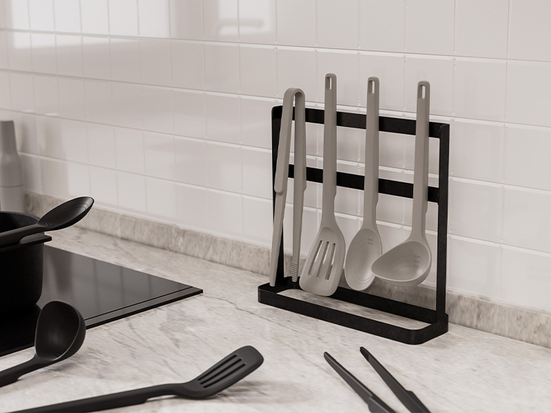 L-TOOLS countertop knife holder with stainless steel utensils, highlighting organized kitchen setup.