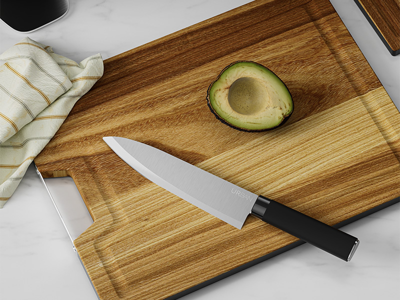 L-TOOLS chef knife on a wooden board with avocado, highlighting precision cutting and kitchen prep.