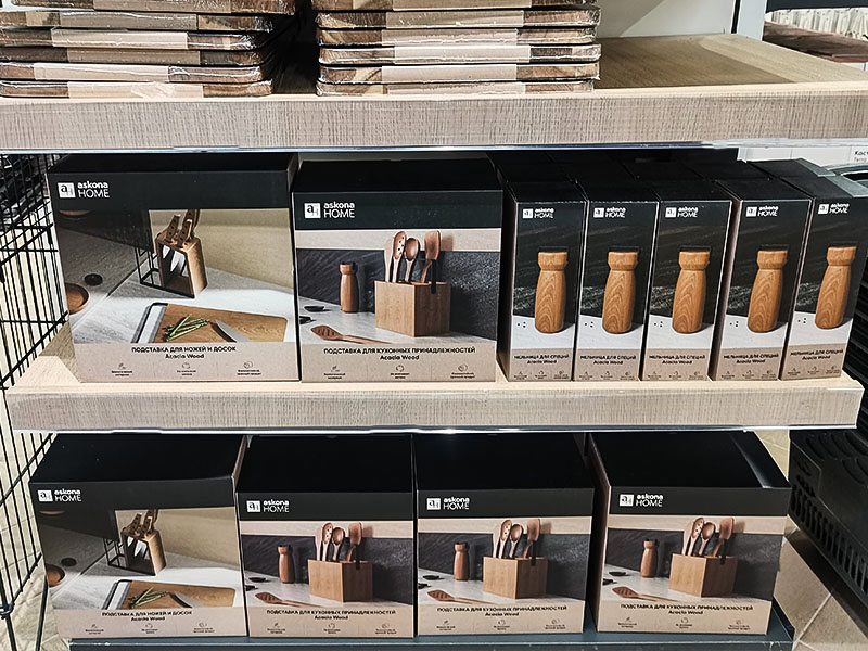L-TOOLS retail shelves showcasing L-TOOLS knives and kitchen products, demonstrating professional merchandising.
